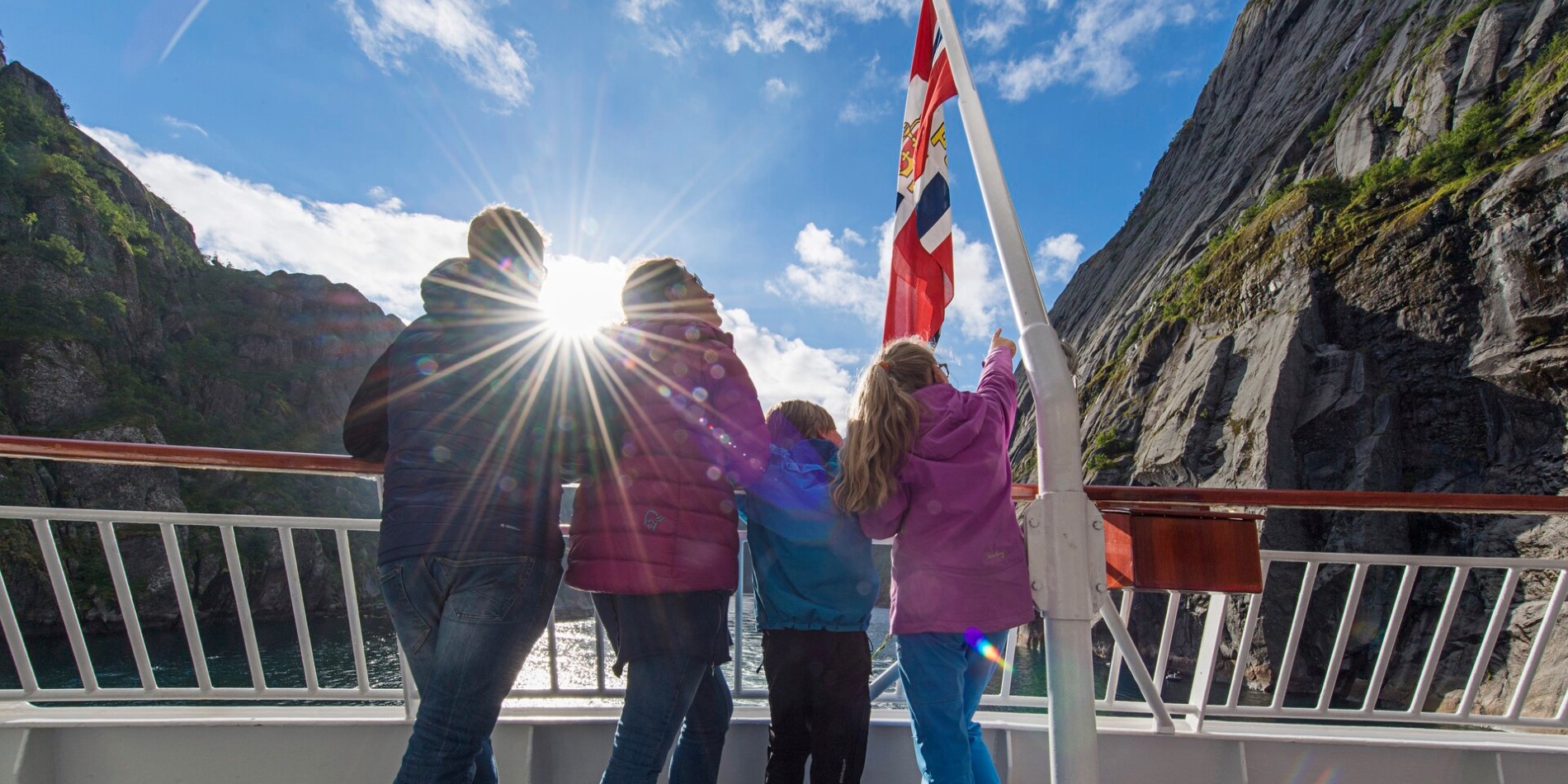 Kids on board deck, fjord in Norway.