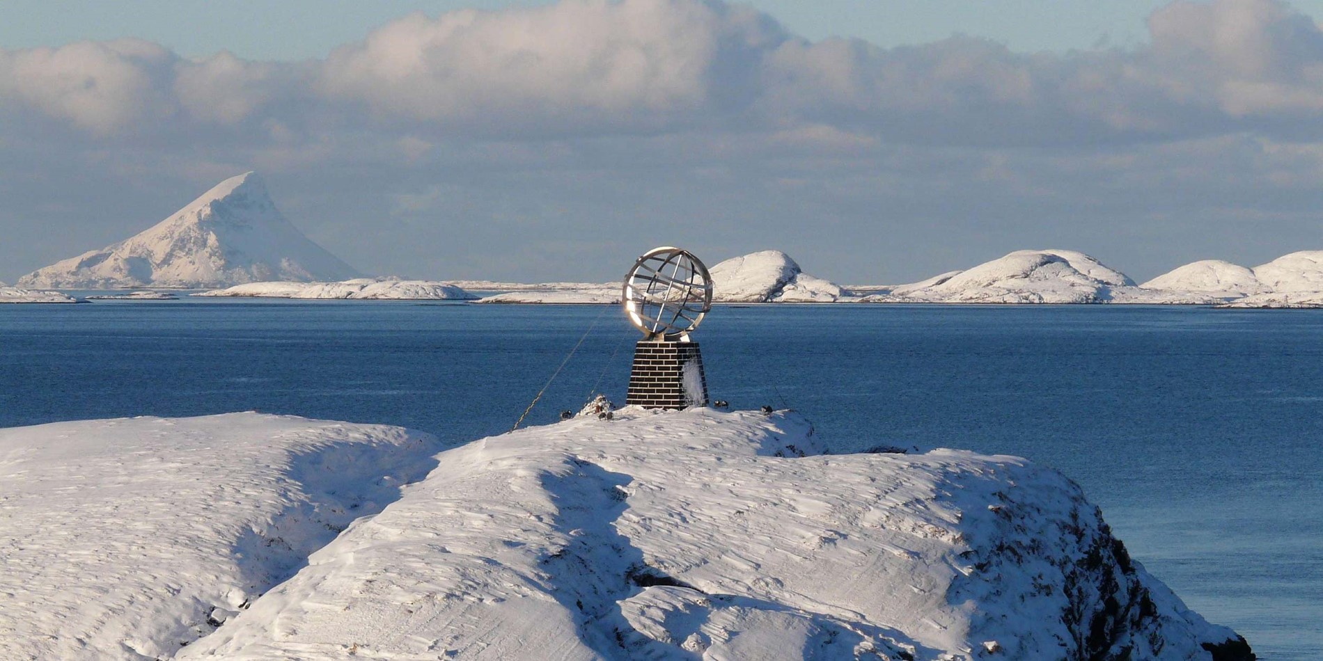 The Arctic Circle monument in winter