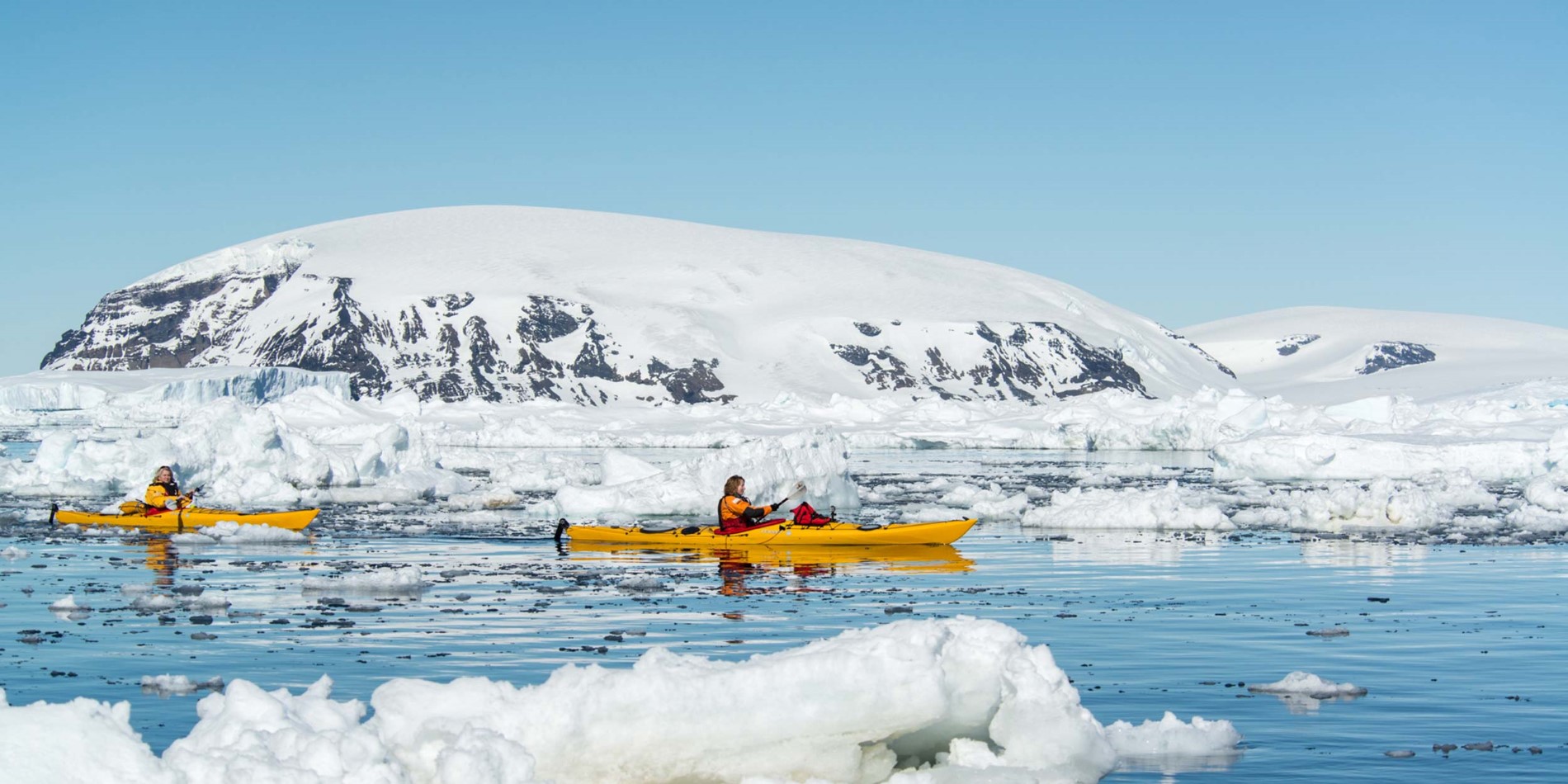 Get close to nature in a kayak paddling past glaciers
